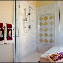 tiled bathroom and glass shower door