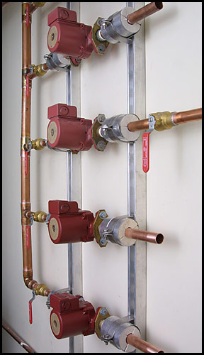 red plastic and copper pipes